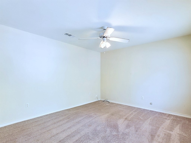 carpeted empty room featuring ceiling fan