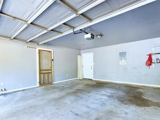 garage featuring electric panel and a garage door opener