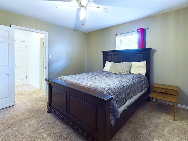 bedroom featuring light colored carpet and ceiling fan