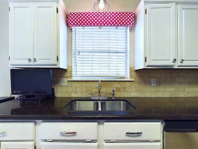 kitchen featuring white cabinets, decorative backsplash, dishwasher, and sink