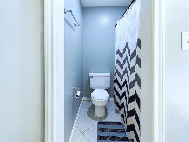 bathroom with tile patterned flooring and toilet