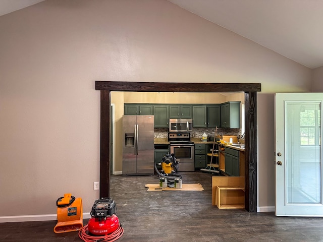 393 Rosewood Dr, Jasper, TX 75951 - kitchen with appliances with stainless steel finishes, green cabinets, vaulted ceiling, tasteful backsplash, and baseboards