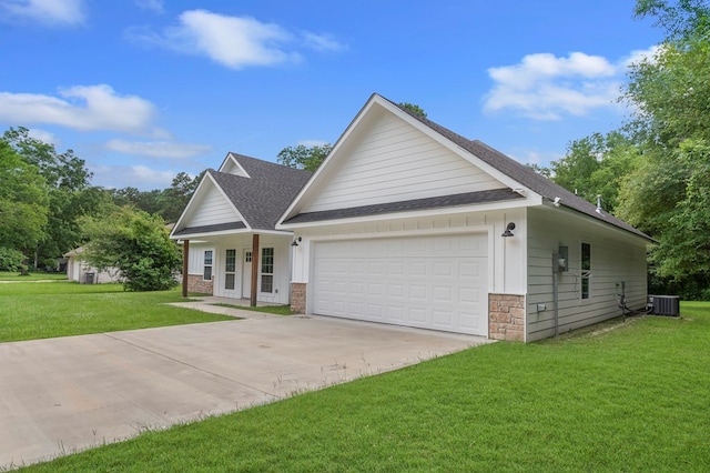 1911 Paul Ave, Lufkin, TX 75901 - view of front facade featuring roof with shingles, concrete driveway, a garage, a front yard, and covered porch