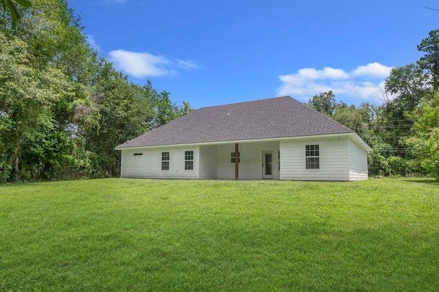 1911 Paul Ave, Lufkin, TX 75901 - rear view of property featuring a lawn and roof with shingles