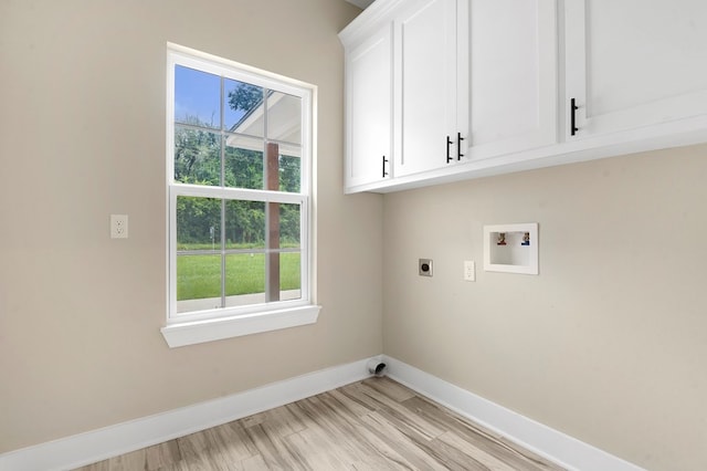 1911 Paul Ave, Lufkin, TX 75901 - laundry area featuring hookup for an electric dryer, cabinet space, hookup for a washing machine, and plenty of natural light