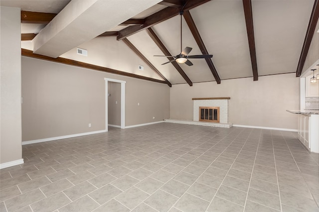 unfurnished living room with a brick fireplace, ceiling fan, light tile patterned floors, beam ceiling, and high vaulted ceiling