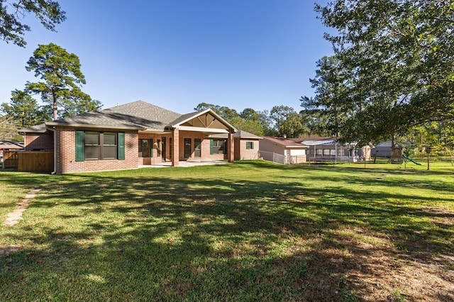 1308 Walnut Bend Dr, Lufkin, TX 75904 - back of house with brick siding and a patio area