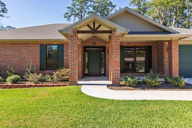 1308 Walnut Bend Dr, Lufkin, TX 75904 - view of front facade with brick siding, roof with shingles, a front lawn, and an attached garage