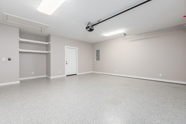 1308 Walnut Bend Dr, Lufkin, TX 75904 - garage featuring a garage door opener, baseboards, and electric panel