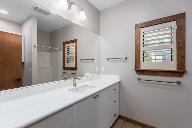 1308 Walnut Bend Dr, Lufkin, TX 75904 - full bathroom featuring vanity, baseboards, and a shower