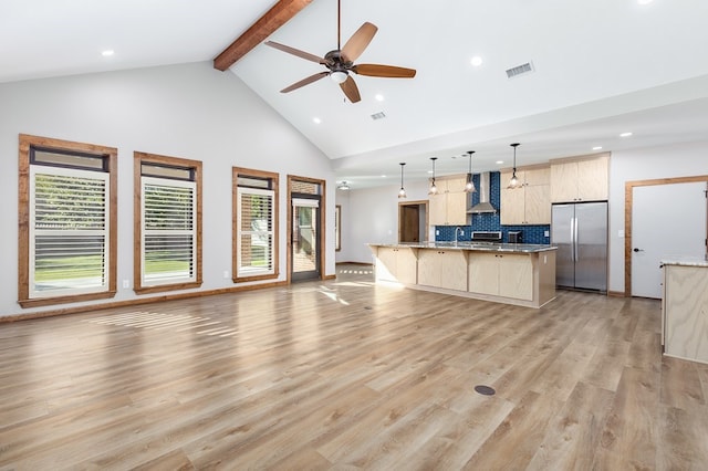1308 Walnut Bend Dr, Lufkin, TX 75904 - unfurnished living room with high vaulted ceiling, recessed lighting, beamed ceiling, healthy amount of natural light, and light wood-style floors