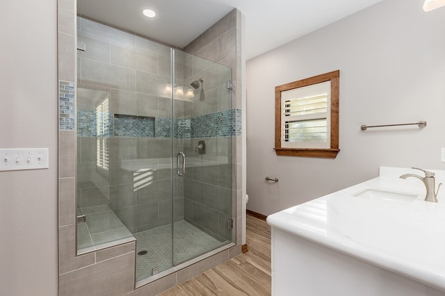 1308 Walnut Bend Dr, Lufkin, TX 75904 - bathroom featuring wood finished floors, a shower stall, vanity, toilet, and baseboards