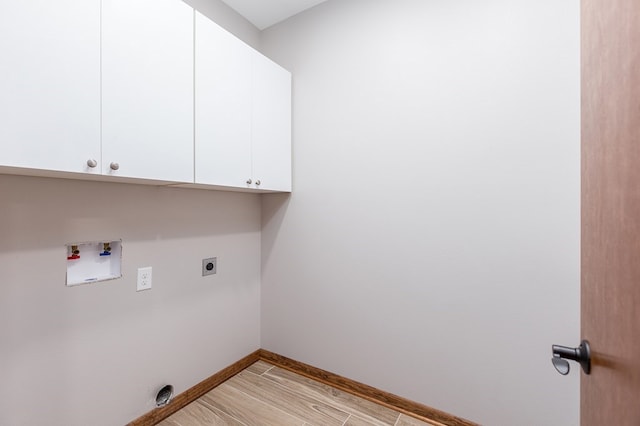1308 Walnut Bend Dr, Lufkin, TX 75904 - laundry room with cabinet space, hookup for an electric dryer, washer hookup, and baseboards