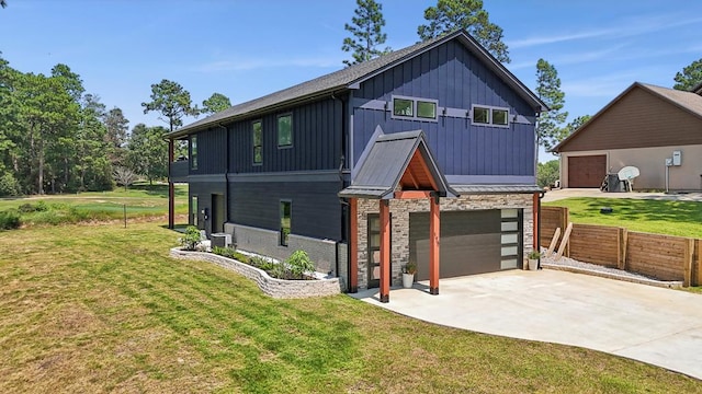 175 Vantage Dr, Brookeland, TX 75931 - view of front of home featuring board and batten siding, concrete driveway, a standing seam roof, an attached garage, and metal roof