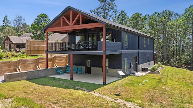 175 Vantage Dr, Brookeland, TX 75931 - rear view of property with a patio, a lawn, board and batten siding, and cooling unit