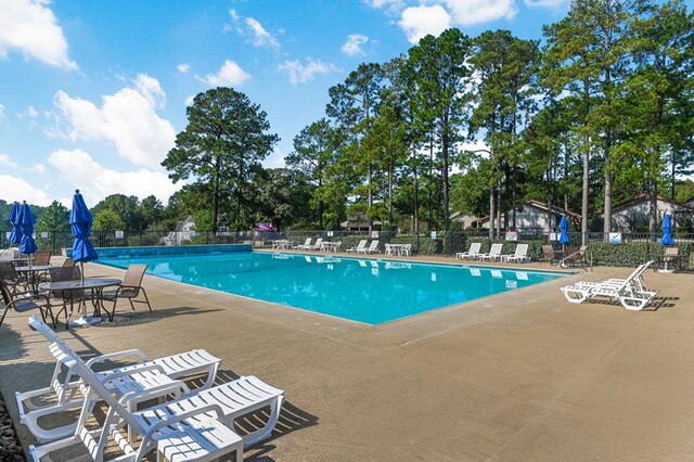 140 Spruce Ln, Brookeland, TX 75931 - community pool featuring a patio area