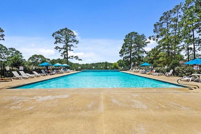 140 Spruce Ln, Brookeland, TX 75931 - community pool featuring a patio