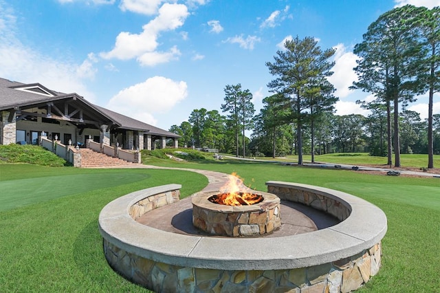 140 Spruce Ln, Brookeland, TX 75931 - view of green lawn featuring a fire pit