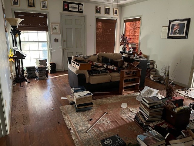 interior space featuring wood-type flooring and ornamental molding