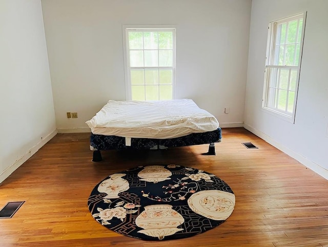 905 Fm 353, San Augustine, TX 75972 - bedroom with light wood-type flooring, visible vents, and baseboards