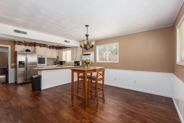 1405 Cimmarron St, Lufkin, TX 75904 - dining area with a chandelier and dark wood-type flooring