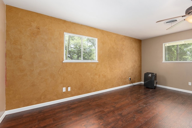 1405 Cimmarron St, Lufkin, TX 75904 - unfurnished room featuring dark wood-type flooring, baseboards, and ceiling fan