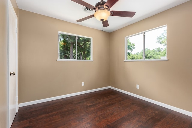 1405 Cimmarron St, Lufkin, TX 75904 - spare room with healthy amount of natural light, baseboards, and dark wood-style flooring