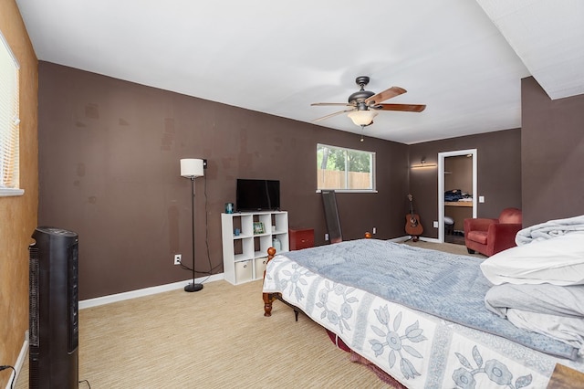 1405 Cimmarron St, Lufkin, TX 75904 - bedroom featuring light carpet, baseboards, a closet, a spacious closet, and a ceiling fan