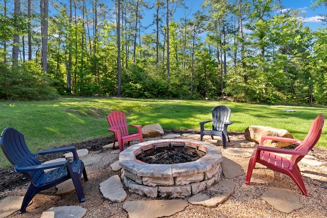 185 Ashley Dr, Brookeland, TX 75931 - view of patio / terrace with an outdoor fire pit