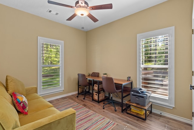 185 Ashley Dr, Brookeland, TX 75931 - home office featuring baseboards, wood finished floors, and a ceiling fan