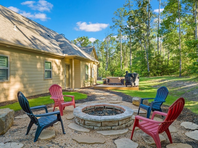 185 Ashley Dr, Brookeland, TX 75931 - view of patio with a fire pit and a hot tub