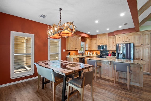 185 Ashley Dr, Brookeland, TX 75931 - dining room with a chandelier, dark wood finished floors, recessed lighting, and baseboards