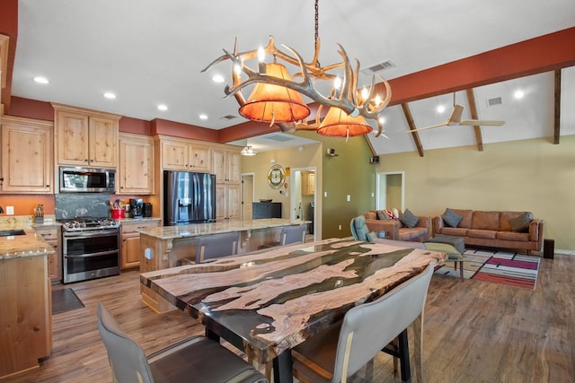 185 Ashley Dr, Brookeland, TX 75931 - dining space featuring a chandelier, wood finished floors, recessed lighting, and baseboards