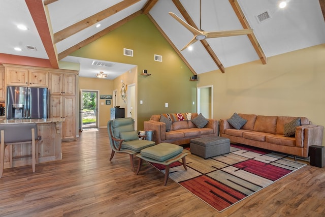 185 Ashley Dr, Brookeland, TX 75931 - living room featuring high vaulted ceiling, wood finished floors, beamed ceiling, recessed lighting, and ceiling fan