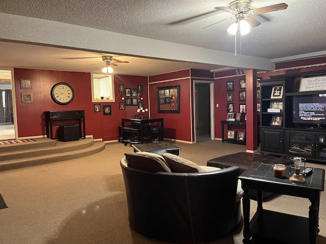 living room with carpet flooring, a textured ceiling, and ceiling fan