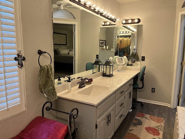 bathroom featuring vanity and hardwood / wood-style flooring