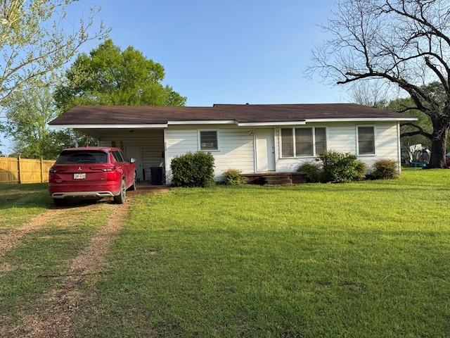 single story home with an attached carport, driveway, fence, and a front lawn