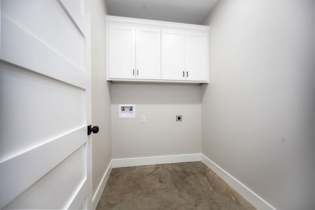 clothes washing area with hookup for an electric dryer, cabinets, and washer hookup