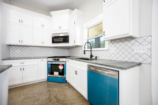 kitchen featuring backsplash, stainless steel appliances, white cabinetry, and sink