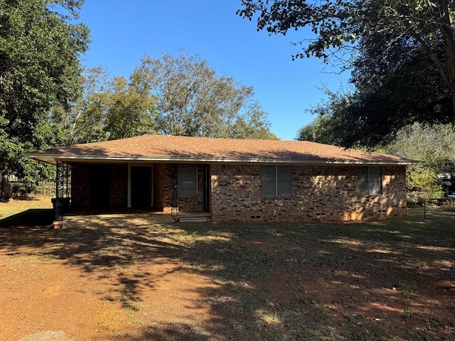 single story home featuring a carport