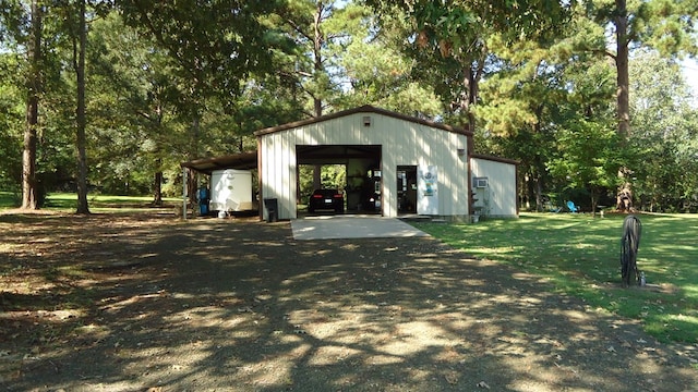 view of outbuilding featuring a lawn