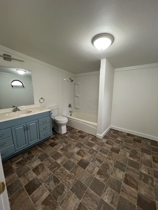 bathroom featuring vanity, baseboards, a textured ceiling, shower / bathing tub combination, and toilet