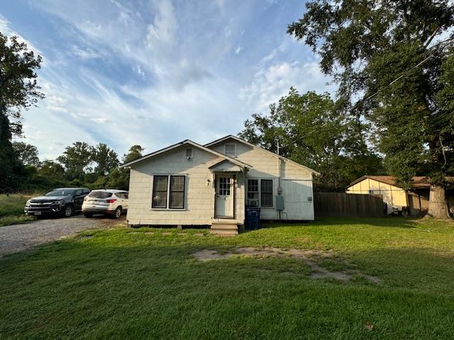 bungalow with a front lawn