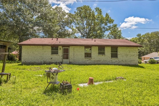 3314 Brook Holw, Nacogdoches, TX 75964 - back of property with brick siding and a lawn