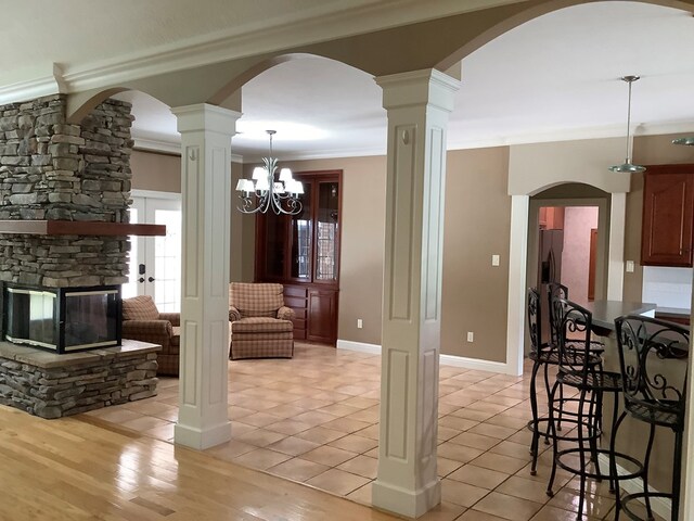 810 Denton Dr, Jasper, TX 75951 - living room featuring ornamental molding, a stone fireplace, and light tile patterned floors