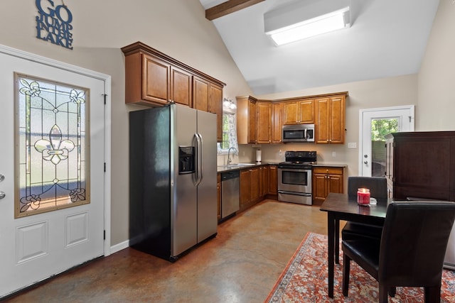 182 Post Oak Ln, Brookeland, TX 75931 - kitchen with stainless steel appliances, brown cabinets, a sink, and plenty of natural light