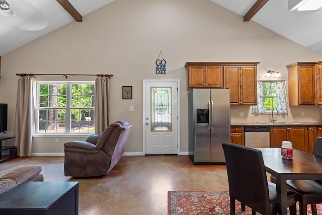 182 Post Oak Ln, Brookeland, TX 75931 - kitchen featuring stainless steel appliances, high vaulted ceiling, a sink, open floor plan, and beamed ceiling