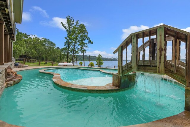 388 County Road 5597, Etoile, TX 75944 - view of swimming pool with a pool with connected hot tub and a water view