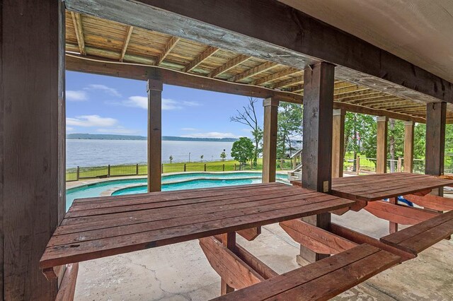 388 County Road 5597, Etoile, TX 75944 - wooden terrace with a water view and an outdoor pool