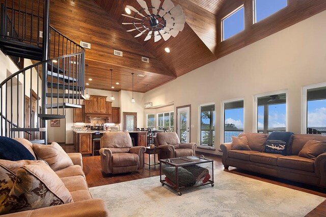 388 County Road 5597, Etoile, TX 75944 - living area with high vaulted ceiling, stairs, plenty of natural light, ceiling fan, and wood finished floors